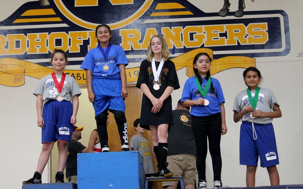 Pictured above is Fillmore Middle School’s Emma Torres who took 1st in the 6th Grade Light Weight Girls Division and Alexa Martinez (far right) who took 4th in the 6th Grade Light Weight Girls Division at the Ventura County Middle School Wrestling Championship Tournament. Photos courtesy Coach Michael Torres. The Fillmore Middle School Wrestling Team concluded its season at the Ventura County Middle School Wrestling Championships at Nordhoff High School in Ojai. The championship was a tournament format where athletes are entered in brackets by age, grade level, and weight class. The eight county teams that competed represented middle schools from Balboa, De Anza, Fremont, Isbell, Matilija, Sinaloa, and Soria.  The Fillmore Bulldogs performed well on the mats. The results were as follows: Emma Torres: 1st Place -6th Grade- Light-weight girls (2-0 with two pins). Meya Garcia: 2nd Place- 8th Grade-Light-middleweight girls (1-1). Jonathan Patino: 3rd Place - 6th Grade- Upper-weight boys (1-1 with one pin). Devin Camacho: 4th Place 7th Grade-Feather-weight boys (0-2). Alexa Martinez: 4th Place -6th Grade-Light-weight girls (1-2 with one pin). Coach Michael Torres would like to thank the athletes’ parents, Fillmore High School Wrestling Coaches Jorge Bonilla and Manuel Ponce, FHS Principal John Wilber, FMS Principal Pablo Leanos, FUSD Staff Sol Andrade, Lynn Cole, Tiffany Emhoff, April Mendez, and Priscilla Montero for their support in making the season a success.