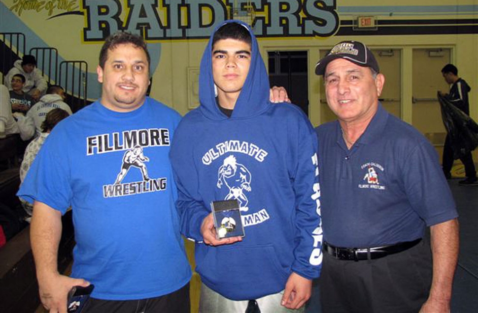 (l-r) Coach Ponce, Robert Bonilla (138 lbs took second place) and Coach Cal. Not pictured is George Orosco who took fifth place at 195 lbs.
