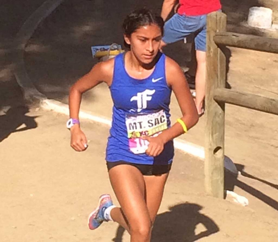 Senior Irma Torres charges up the hill.