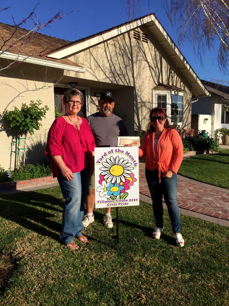 Theresa Robledo presents Civic Pride Vision 20/20 Yard of the Month along with a generous gift Certificate from Otto &  Sons Nursery for $40 to Ray & Nancy Cervantez.