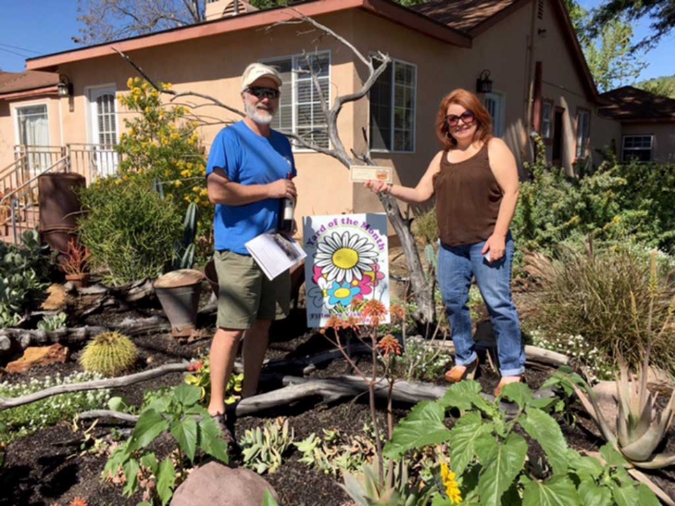 Dave and Jenna Miller were presented with a gift certificate from Otto & Sons Nursery for being Civic Pride Vision 20/20’s Yard of the Month.