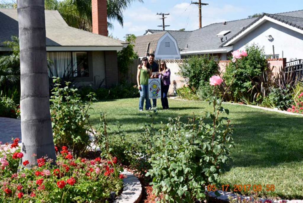 (l-r) Norma Gil, Jose Gil, and Ari Larson. The May 2017 Yard of the Month was presented to Jose and Norma Gil along with a $40 gift certificate (courtesy of Otto & Sons) by Ari Larson (representing Fillmore Civic Pride). Some of the pleasing landscape features include, roses, Arum Lily, Lantana, ferns, palms garden sage, geraniums and formio. The home is located at 254 Casner Way. For more information on Fillmore Civic Pride please call Ari at 805-794-7590.