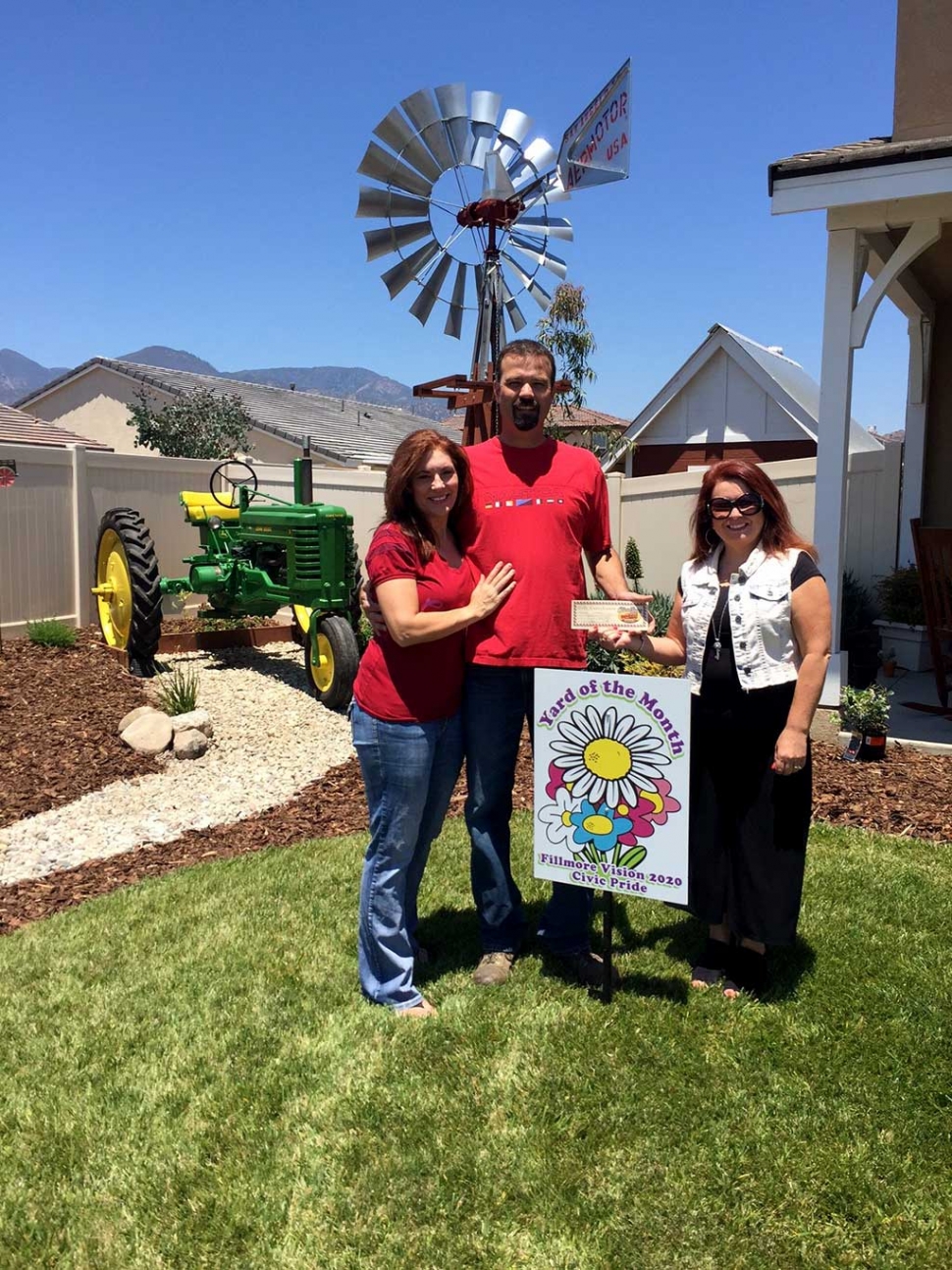 Yard of the Month winners Kevin and Sheryl with Theresa Robledo.