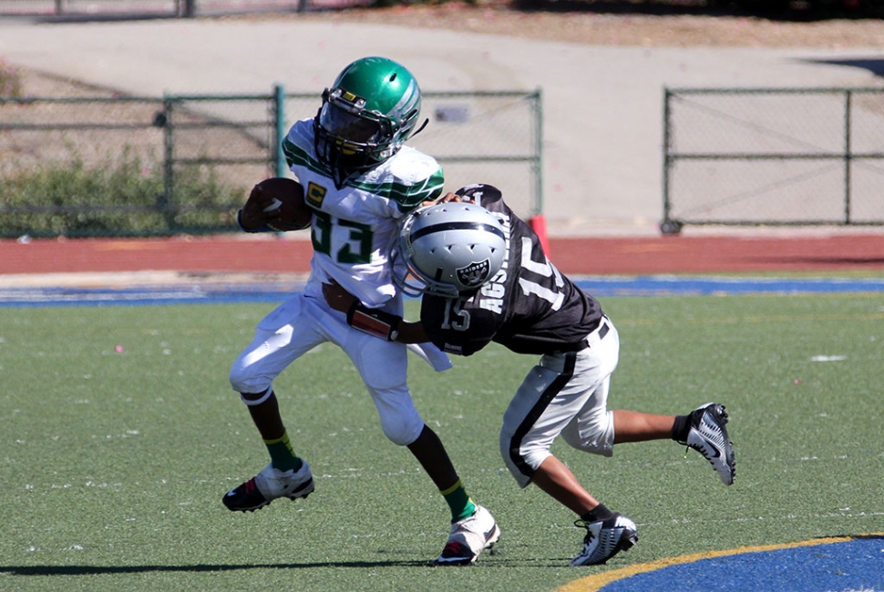 Raiders bantam silver #15 makes a tackle